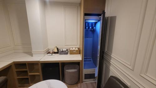 a small bathroom with a sink and a shower at Hotel Label Seongnam in Seongnam