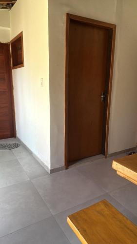 an empty room with a door and a tile floor at Casa Sophi in Cruz