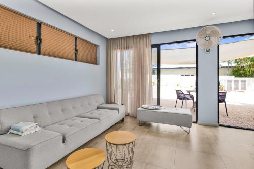 a living room with a couch and a table at INDIGO Apartments & Suites - 'Adults Only' in Jan Thiel