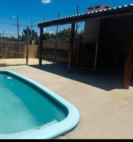 a large swimming pool in front of a building at Casa de Hóspedes Kipper in São Gabriel