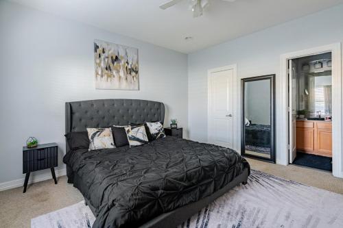 a bedroom with a large bed in a room at Fireside Double Kings Midtown Luxe Suite in Houston