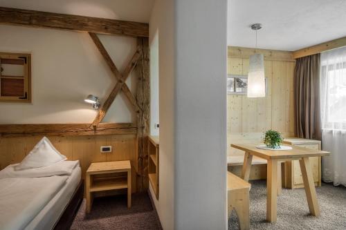 Postel nebo postele na pokoji v ubytování Hotel Gran Ciasa