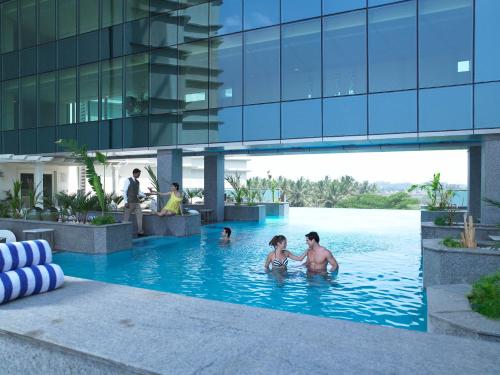 a group of people in a swimming pool in a building at The Zuri Whitefield Bengaluru in Bangalore