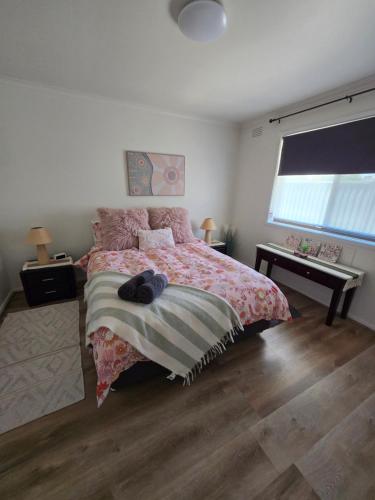 a bedroom with a bed and a desk and a window at LBarza 1BR CBD Self Contained Apartment in Shepparton