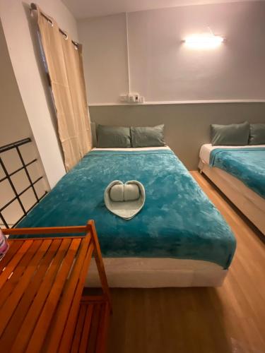a room with a bed with a heart on it at SridaHouse#Near Central Festival Hatyai in Hat Yai