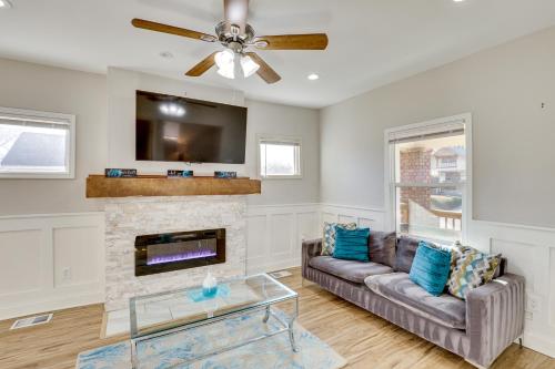 a living room with a couch and a fireplace at Midtown Get Away in Kansas City