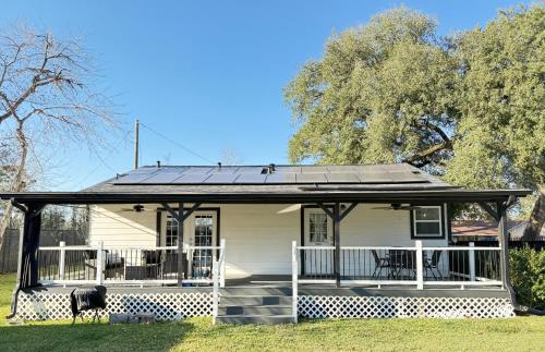 a house with solar panels on the roof at 2 bed 2 bath Modern Farmhouse in Old Town Spring in Spring