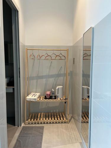 a display case in a store with a mirror at Ancor Homestay in Phan Rang–Tháp Chàm