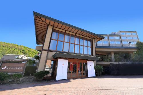 a building with a large window and a door at Yutorelo Toyako in Lake Toya