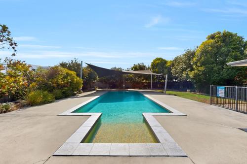 a swimming pool with a gazebo in a yard at Mango Hill 3 Bedroom Family Accommodation in North Lakes
