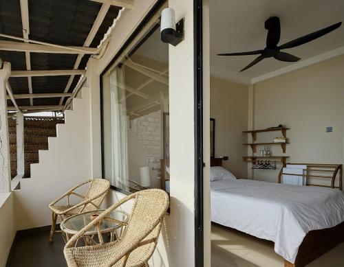 En eller flere senge i et værelse på Pelican Ahangama