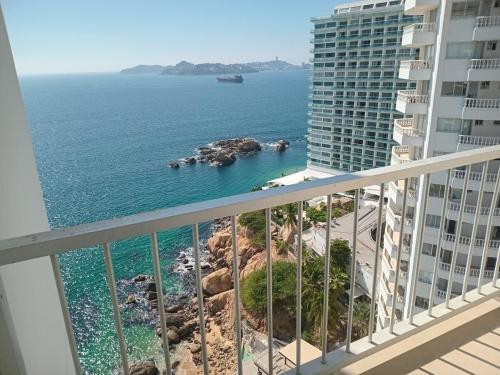 a view of the ocean from a balcony of a building at Suite en Torres Gemelas Acapulco piso 19 in Acapulco