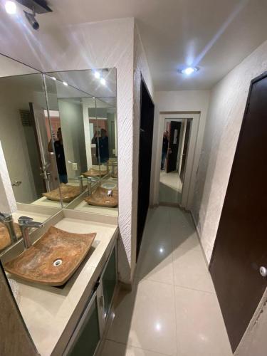 a bathroom with a wooden cutting board on a counter at Suite en Torres Gemelas Acapulco piso 19 in Acapulco