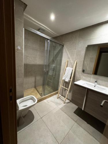 a bathroom with a shower and a toilet and a sink at Murcia in Rabat