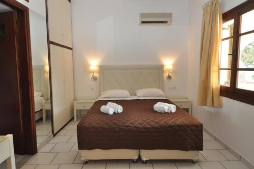 Кровать или кровати в номере Pennystella Apartments