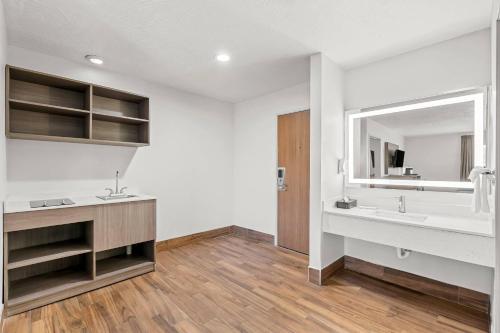 a bathroom with two sinks and a mirror at Quality Inn Beaver I-15 in Beaver