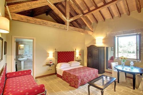 a bedroom with a bed and a table in a room at Tenuta Monacelli Lecce in Lecce