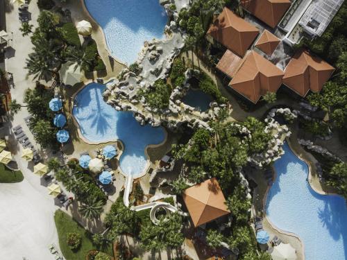 an overhead view of a resort with swimming pools at Hyatt Regency Grand Cypress Resort - Free Shuttle to Theme Parks! in Orlando