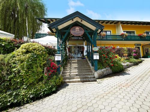 a entrance to a building with stairs and flowers at Krumbacherhof in Krumbach Markt