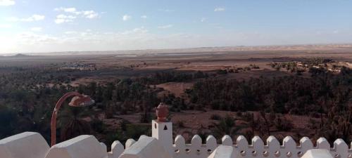 a view from the top of a white fence at Forteresse Ait-Mezline in Timimoun