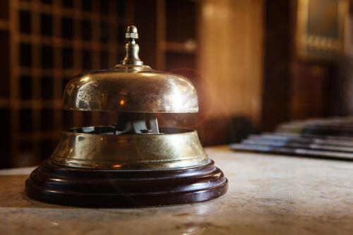 an old bell sitting on top of a table at Hotel Max in Aversa