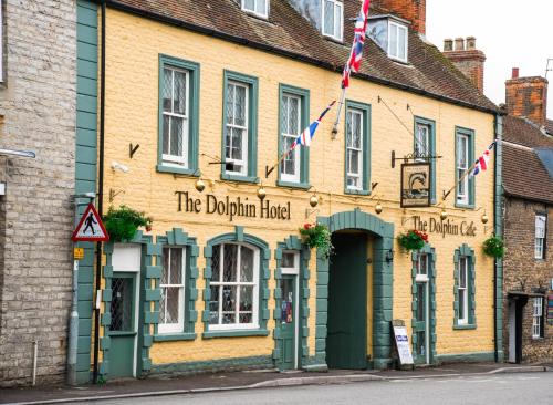 a building with the durham hotel on a street at The Dolphin Hotel in Wincanton