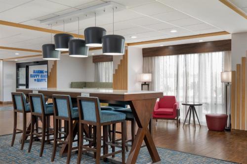 a conference room with a table and chairs at Hampton Inn Lake Charles in Lake Charles