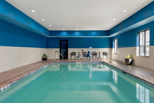 a pool in a hotel room with blue walls at Hampton Inn Lake Charles in Lake Charles