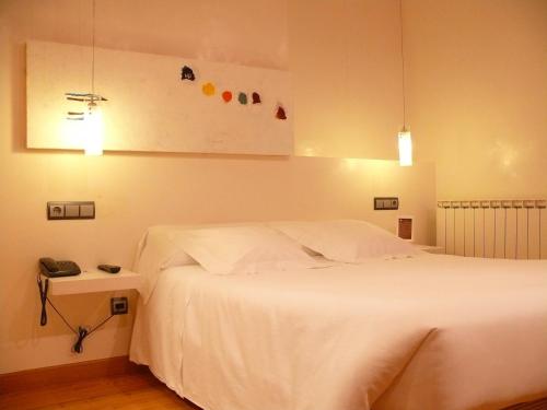 Postel nebo postele na pokoji v ubytování Hotel Nochendi