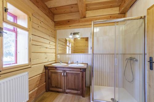 a bathroom with two sinks and a shower at Roubenka Nové Hutě in Nové Hutě
