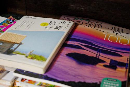 a book sitting on top of a table at Minshuku Kuroshima in Kuroshima