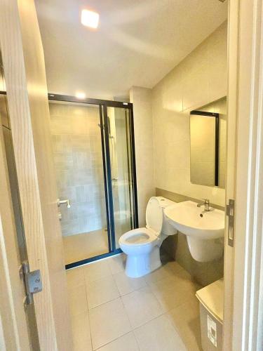 a bathroom with a toilet and a sink at Dcondo reef 99 in Kathu
