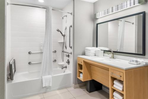 a bathroom with a sink and a shower at Home2 Suites By Hilton Dallas Grand Prairie in Grand Prairie