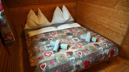 a bed with christmas decorations on it in a room at Chata Sauna Sosna in Litmanová