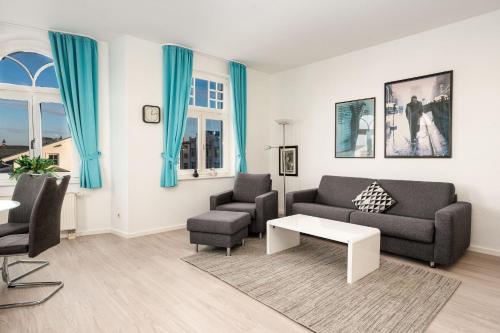 Et opholdsområde på Ferienwohnung 10 Haus Metropol