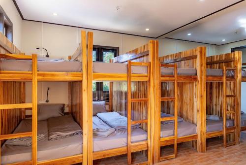 a group of bunk beds in a room at Nongkhiaw IngIng Backpackers Hostel in Nongkhiaw
