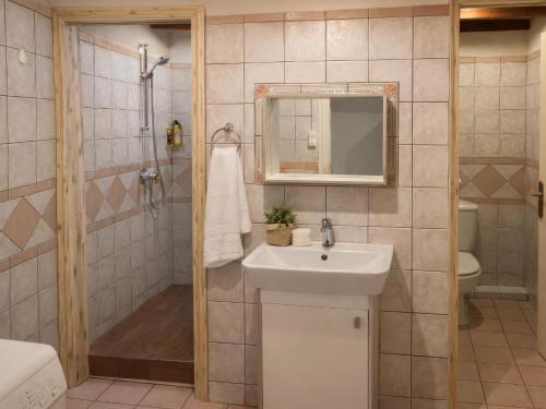 a bathroom with a sink and a shower at Filia Garden in Samos