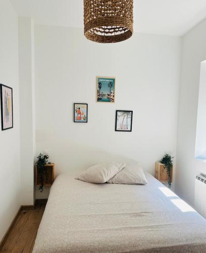 Postel nebo postele na pokoji v ubytování Maisonnette de ville
