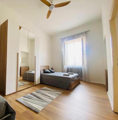 a bedroom with a large mirror and a bed at A Casa Lucia in Montefiascone