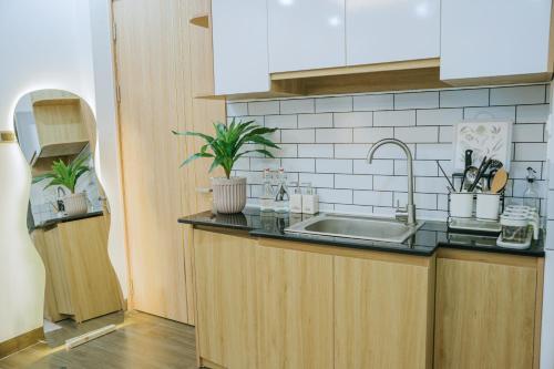 a kitchen with a sink and a counter top at Dubai House in Hanoi