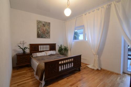 a bedroom with a bed and a window at Vilnius Luxury Apartment 1 in Vilnius