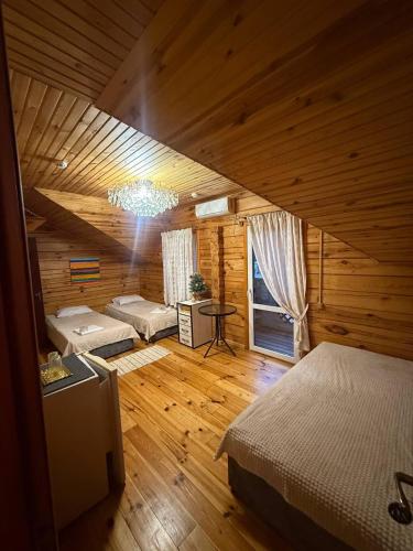 a bedroom with a bed and a table in a room at Nester House in Svityazʼ
