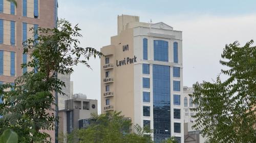 a tall white building with the words luttgart on it at فندق لافي بارك in Mecca