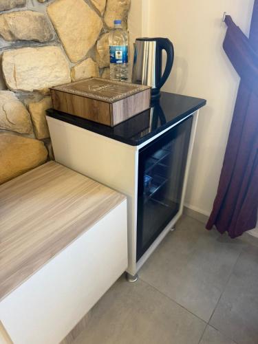 a counter with a bottle of water on top of it at Harran Kümbet Otel in Harran