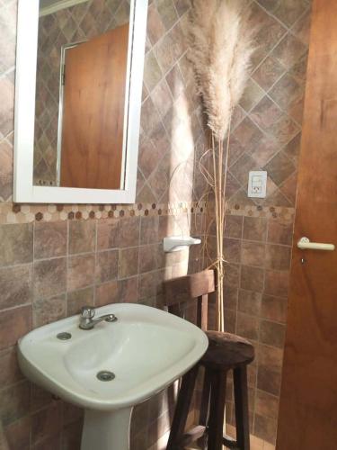 a bathroom with a sink and a mirror at La Marita in Gualeguay