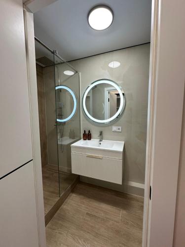 a bathroom with a sink and a mirror at ЖК Сонячна Тераса in Ternopil