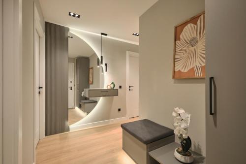 a living room with a bench and a sink at BSY Flats Well Decorated Modern Apartments With 2BR, 3BR Options in Istanbul