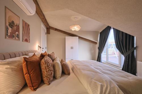 a bedroom with a large bed and a window at BSY Flats Well Decorated Modern Apartments With 2BR, 3BR Options in Istanbul
