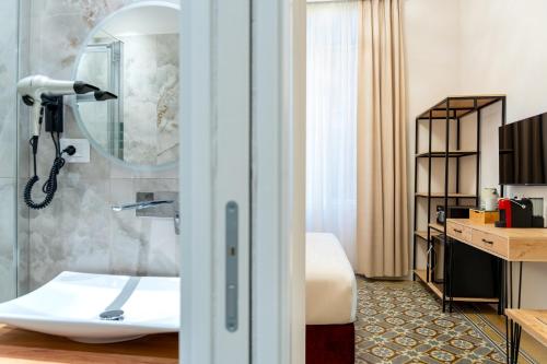 a hotel room with a bathroom with a sink at Fiume 20 - Residence in Florence