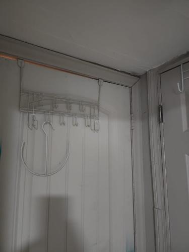 a shower curtain in a room with a window at Bridgeport East Main in Bridgeport